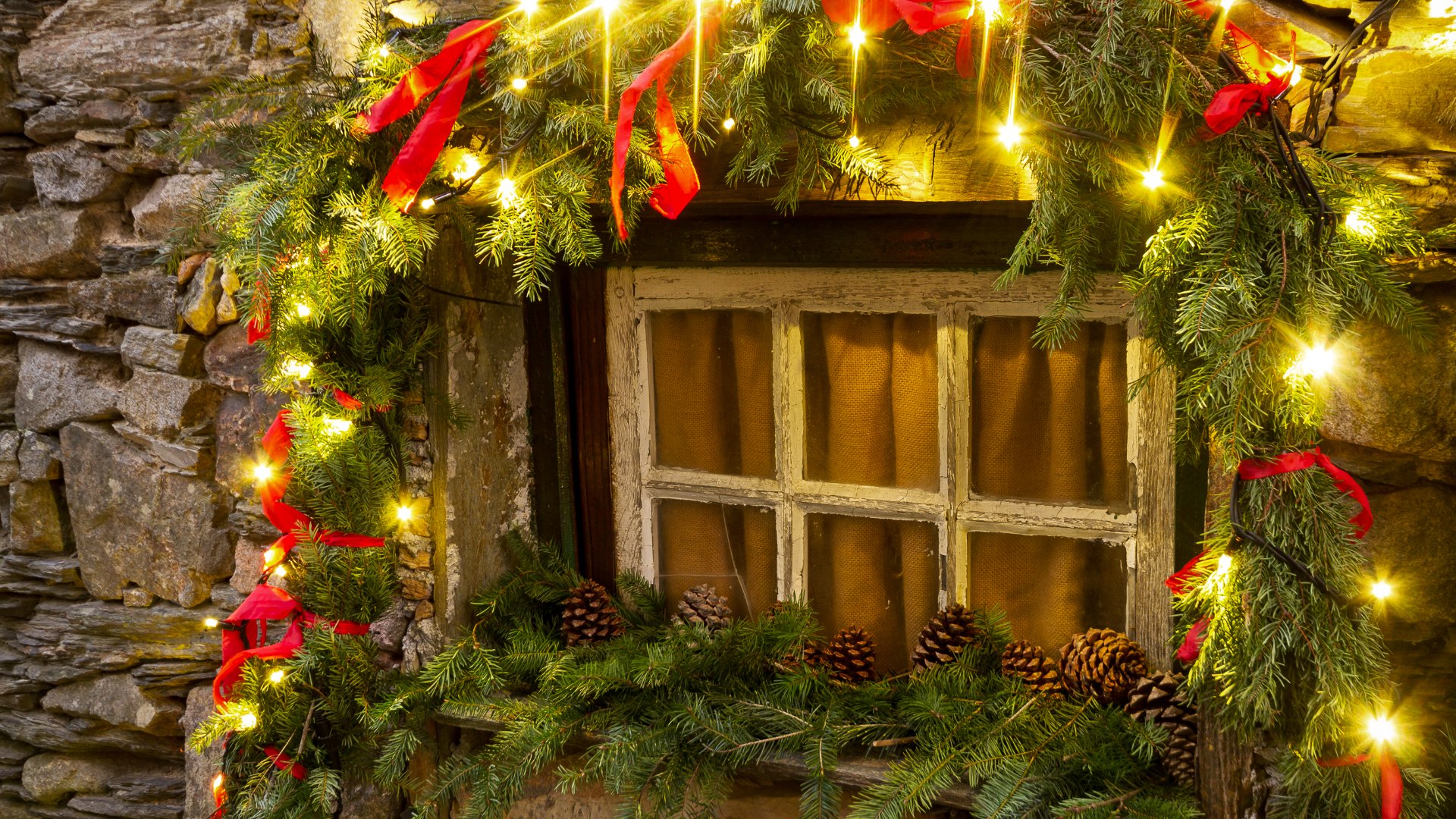 Thousands of LED lights illuminate the schist houses and decorated streets, creating a magical winter atmosphere in this mountain village