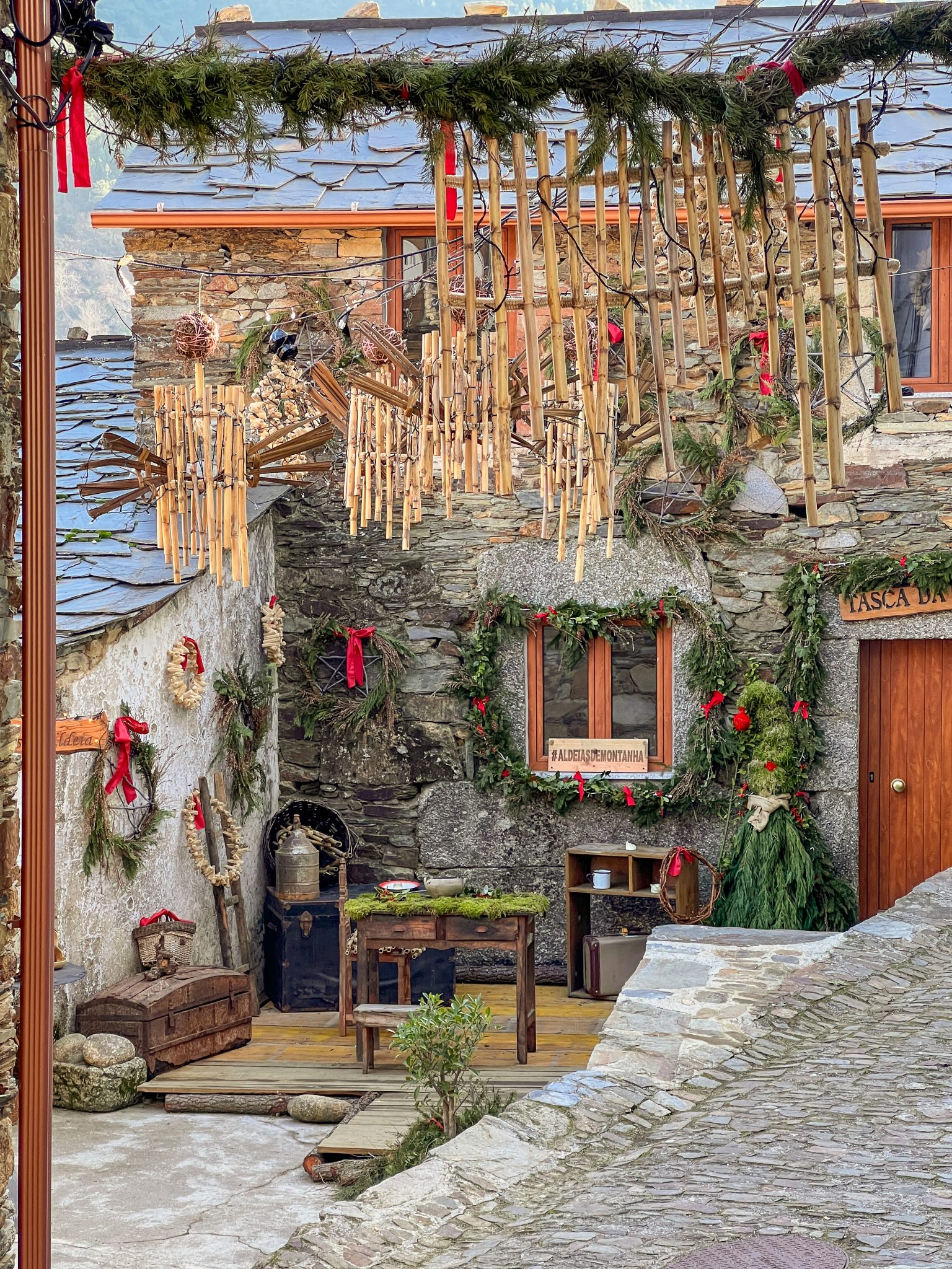 Christmas in Cabeça Village Rustic stone house decorated with bamboo ornaments and natural wreaths for Christmas season