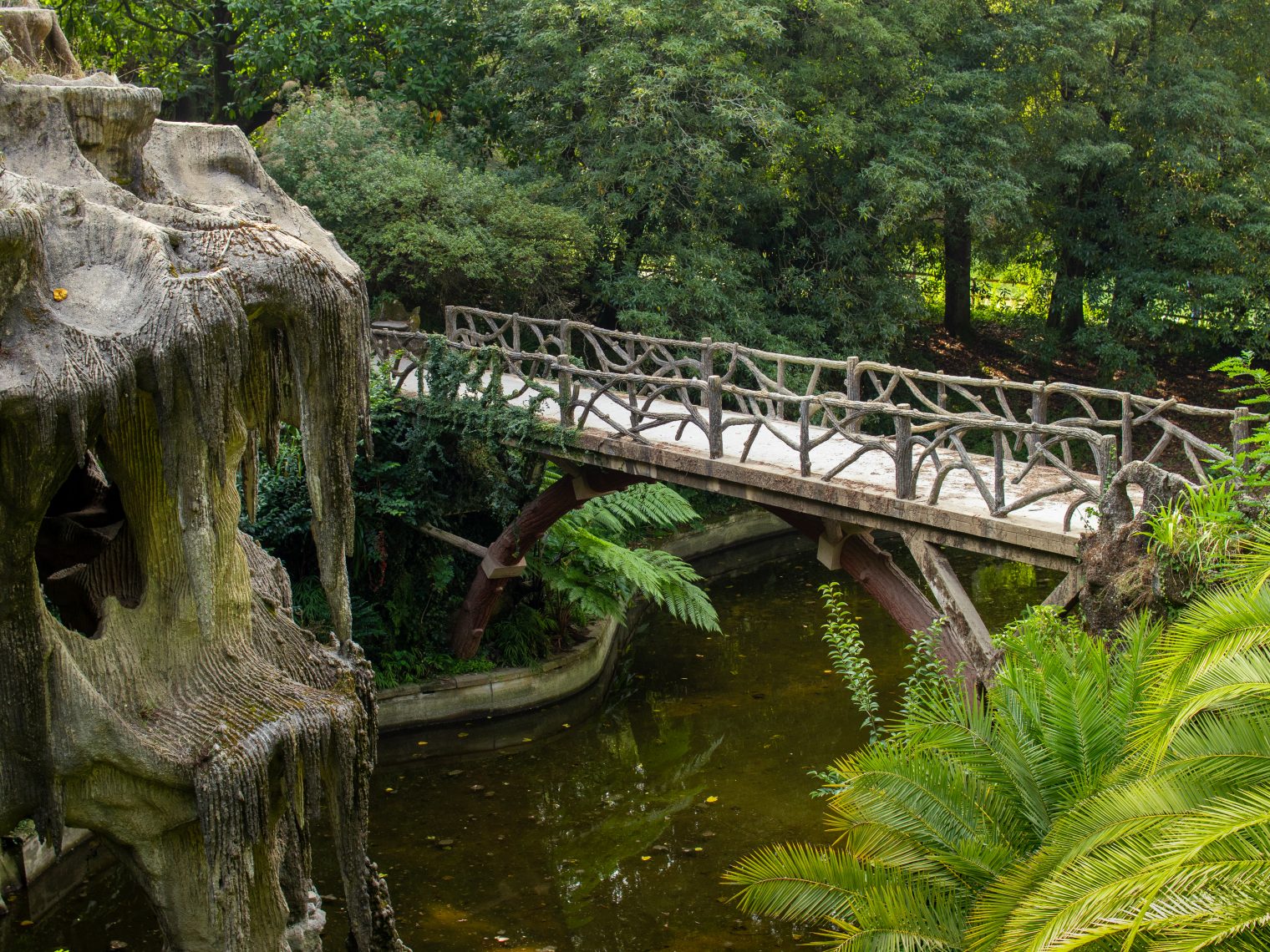 Bridge over pond at Quinta do Castelo park near Feira Castle